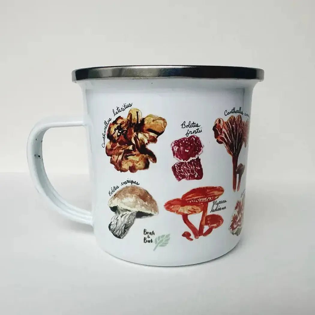 A white Brush & Bark Camping Mug with a silver rim sits on a white background, displaying colorful mushroom illustrations.
