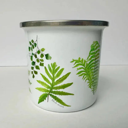 A white Brush & Bark Camping Mug with green fern designs sits on a white surface against a plain background.