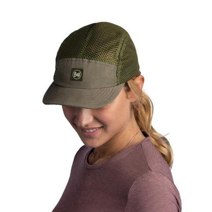 A woman wears the Buff 5 Panel Air Cap - Saret in Military color, shown from a side angle against a white background.