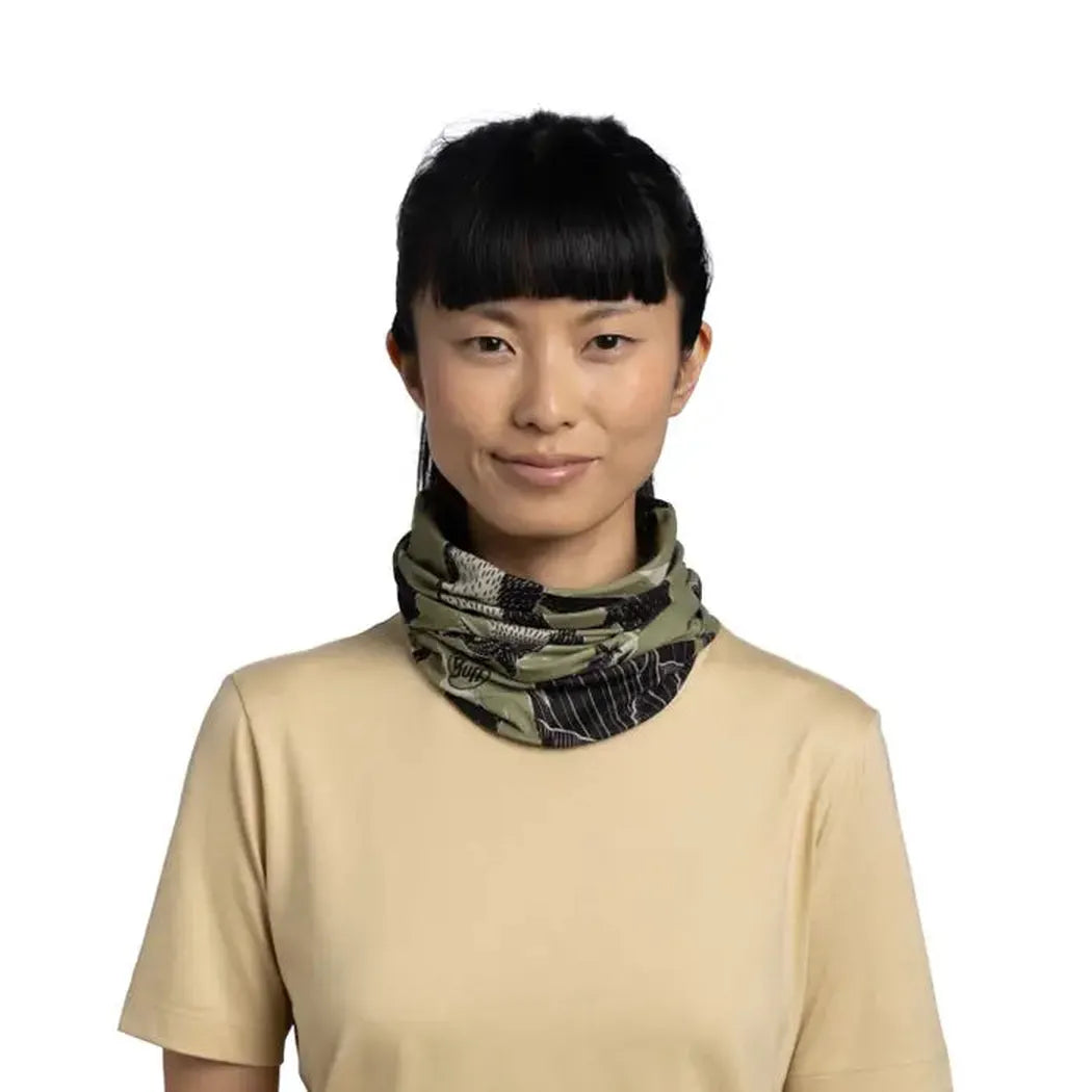 A model wears the Khaki Buff CoolNet UV - Rub Chomp bandana against a plain white background.