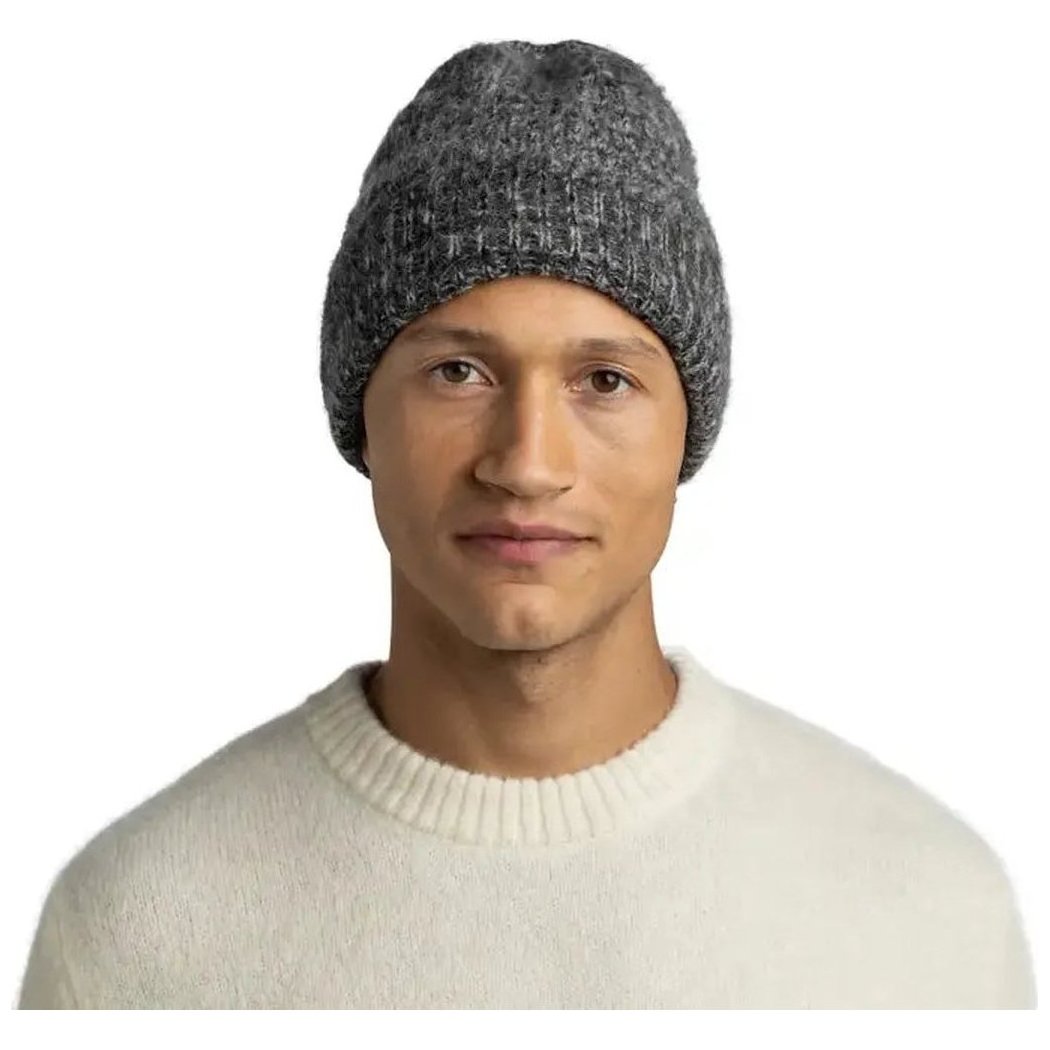 A model wears the Graphite Buff Knitted Beanie - Irna against a plain white background.