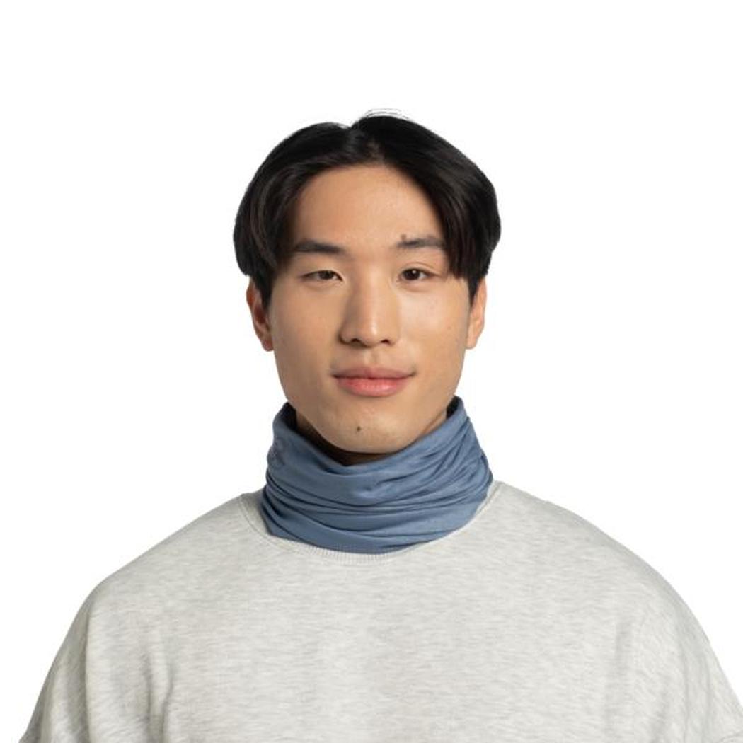A front view of a model wearing the Buff Original EcoStretch - Solid Water neck gaiter against a white background.