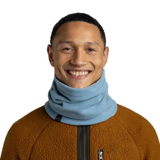 A model wears the Lake Blue Buff Polar Neckwarmer - Solid against a plain white background.