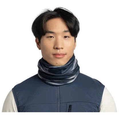 A front view of the Buff Polar Reversible - Arky in Navy worn by a model against a white background.