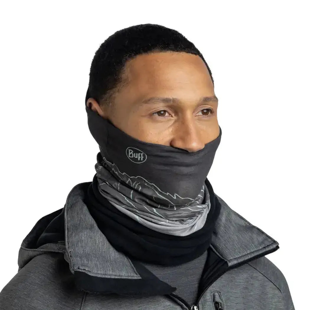 A front view of a model wearing the Buff Polar - Unal G grey bandana against a white background.
