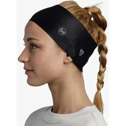 Side view of the Buff ThermoNet Headband Solid on a model with a braid, against a plain white background.
