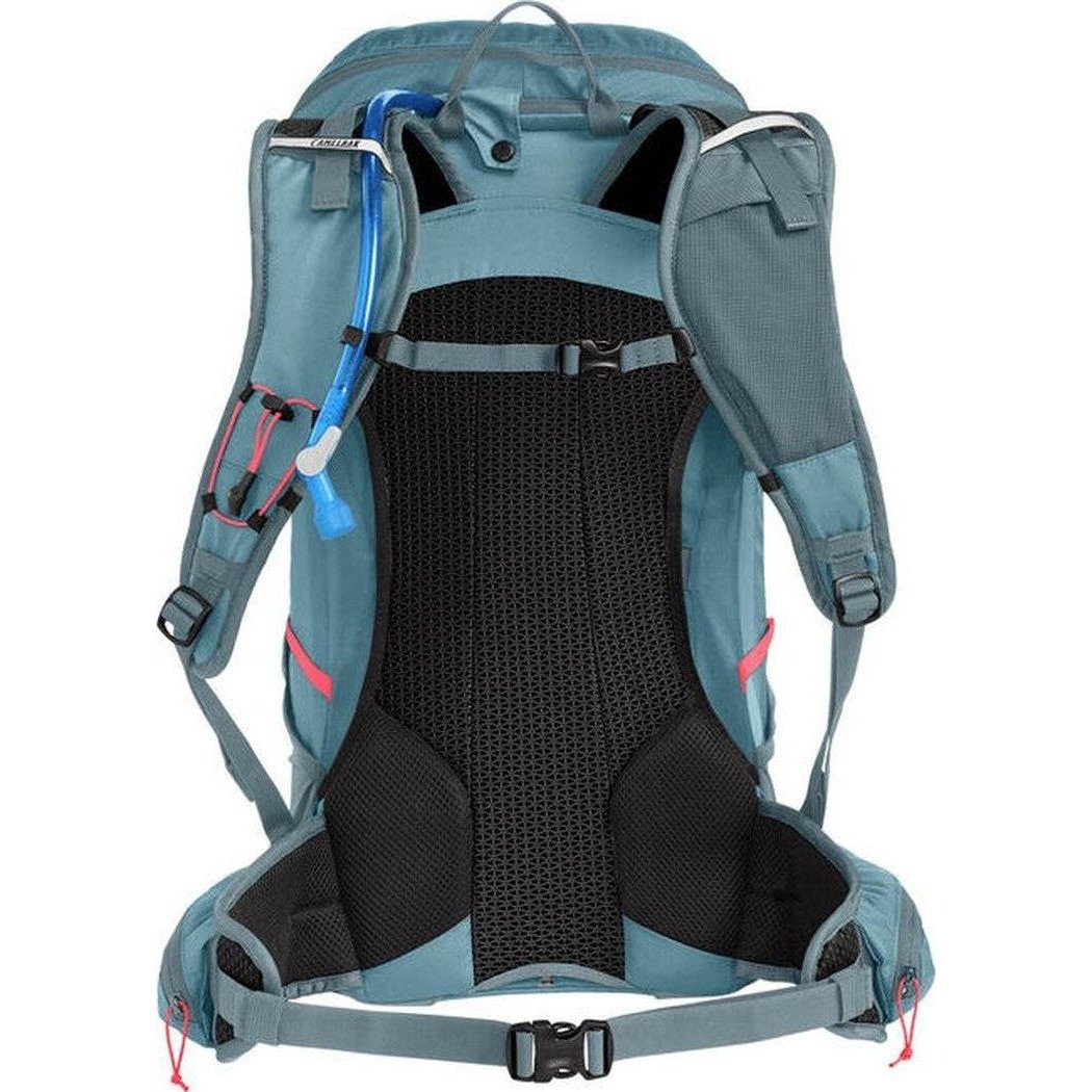 Back view of the CamelBak Women's Fourteener 30 in Smoke Blue/Fiery Coral showing the breathable mesh back panel and hydration tube.
