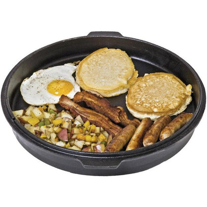 A top-down view of the Camp Chef Cast Iron Deluxe Dutch Oven 12" filled with breakfast items like eggs, pancakes, and sausages.