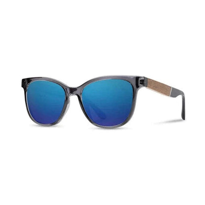 Side view of the Camp Eyewear Cove sunglasses with blue opal lenses and a charcoal frame, showing the wooden temple detail against a white background.