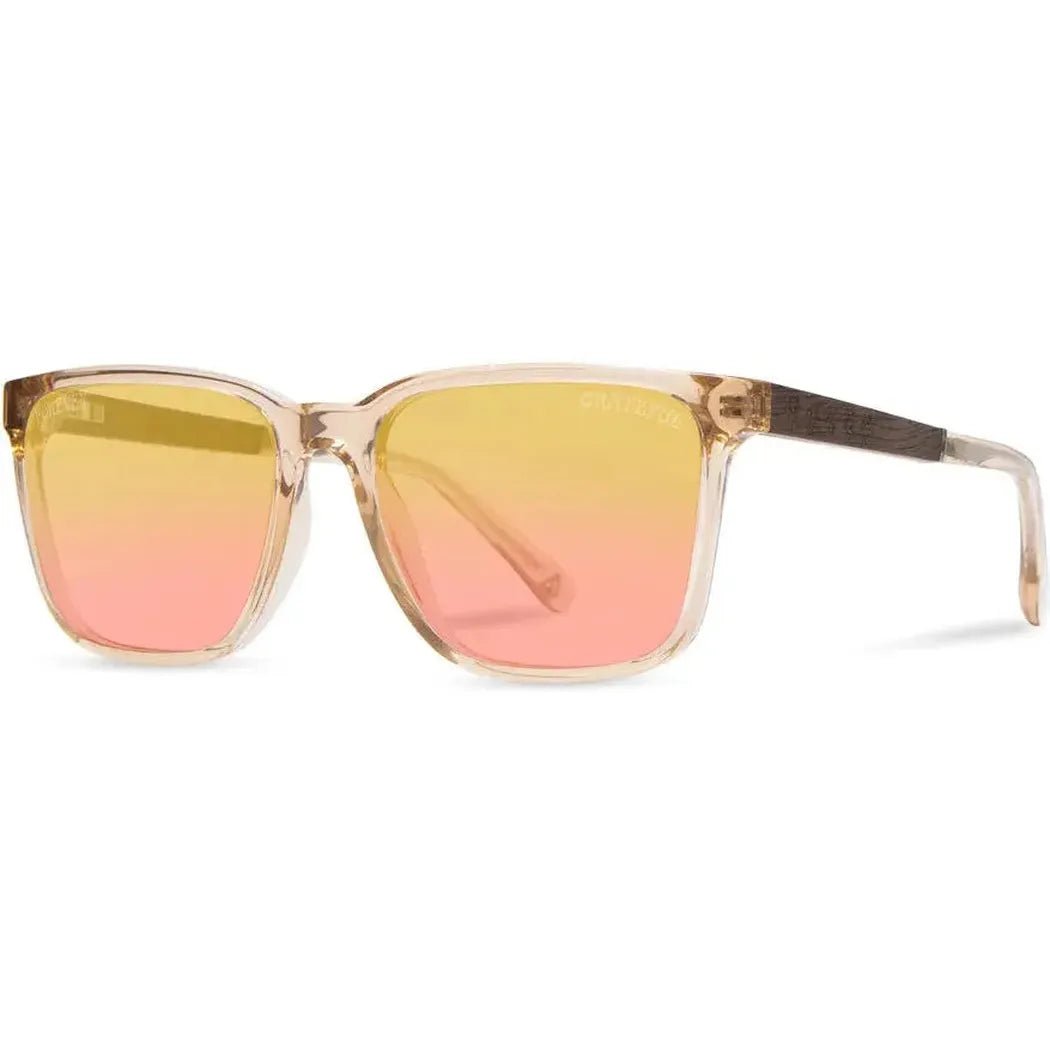Side view of the Camp Eyewear Crag: Grateful Dead Stealie Edition sunglasses with gradient pink and yellow lenses against a white background.