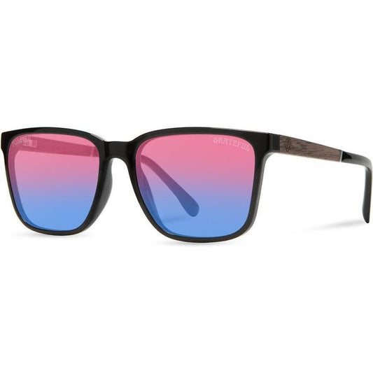 Side view of the Camp Eyewear Crag: Grateful Dead Stealie Edition sunglasses with black frames and colorful gradient lenses against a white background.