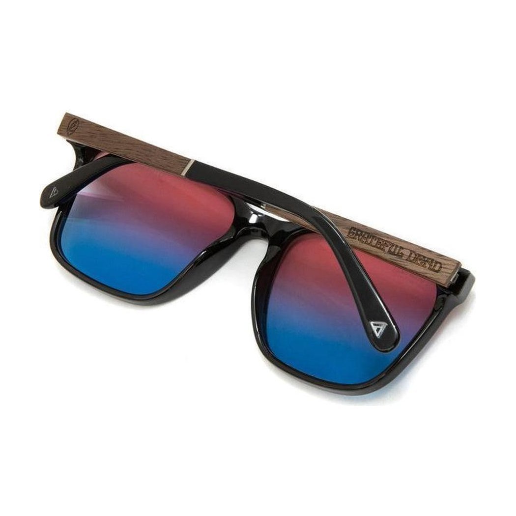 Side view of the Camp Eyewear Crag: Grateful Dead Stealie Edition sunglasses with black frames and Grateful Dead Stealie engraved on the temple against a white background.