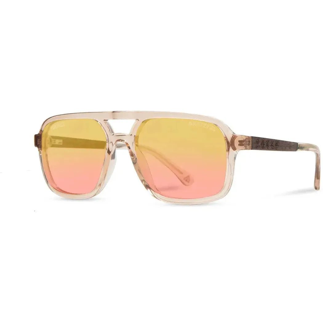 Side view of the Camp Eyewear Glacier: Grateful Dead Bears Edition sunglasses with gradient yellow to pink lenses and a clear frame, against a white background.