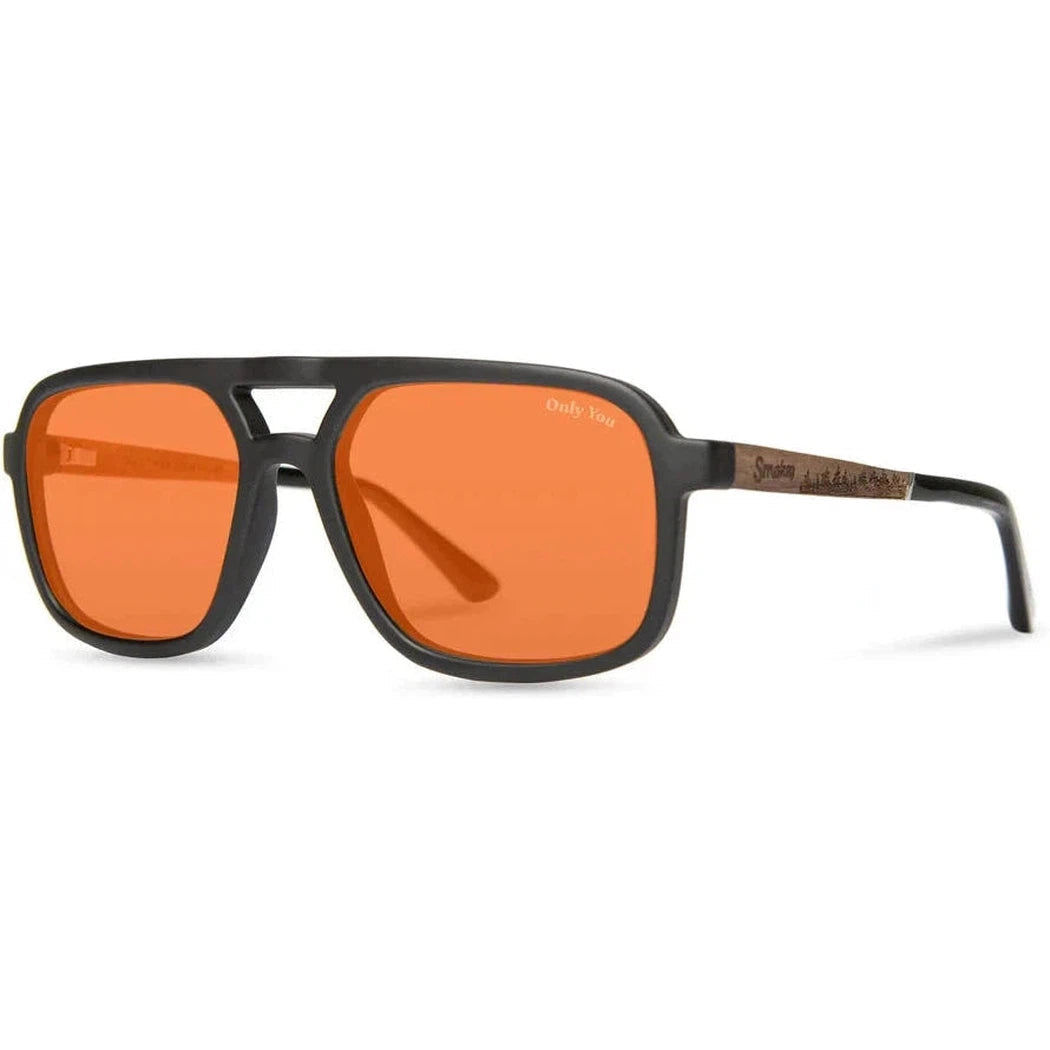Side view of the Camp Eyewear Glacier - Smokey Bear sunglasses with matte black frames and orange lenses against a white background.