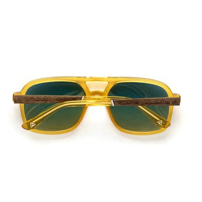 Front view of the Camp Eyewear Glacier - Yellowstone Edition sunglasses with yellow frames and walnut arms against a white background.