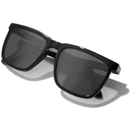 Side view of the Camp Eyewear Ridge sunglasses with black frames and dark lenses against a white background.