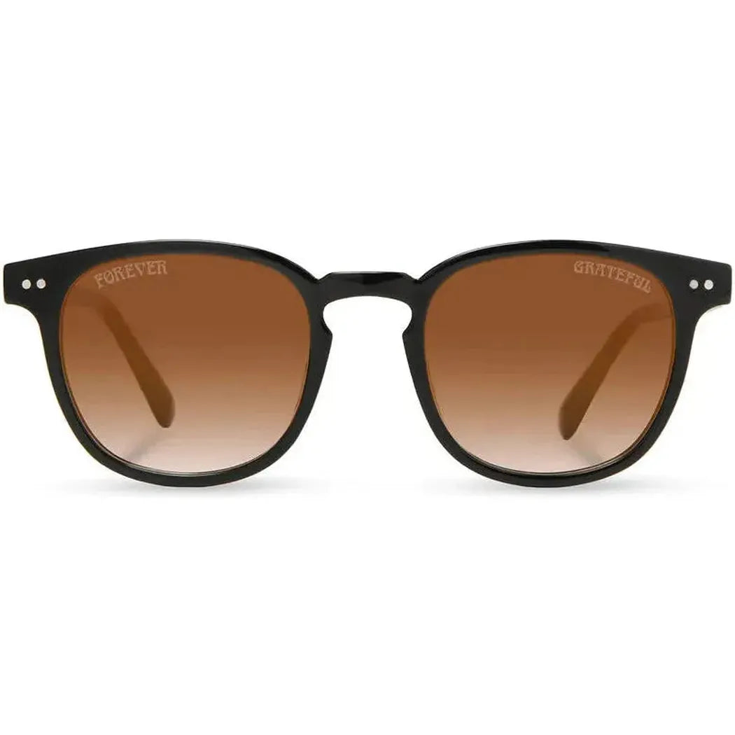 Black Camp Eyewear Topo: Grateful Dead Stealie Edition sunglasses with brown gradient lenses and engraved "Grateful" on the right lens, shown front on against a white background.
