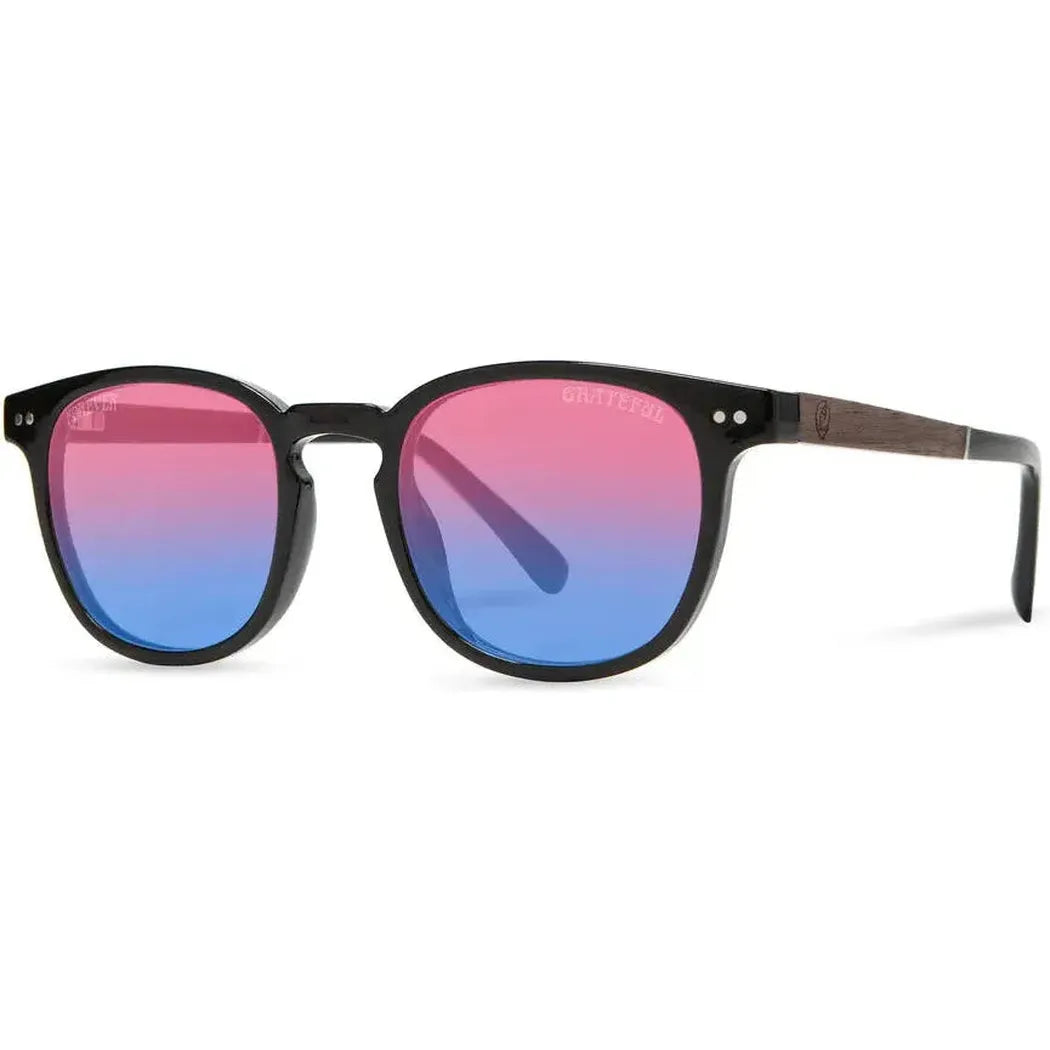 Side view of the Camp Eyewear Topo: Grateful Dead Stealie Edition sunglasses with black frames and colorful gradient lenses against a white background.