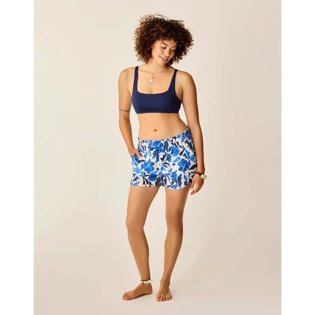 A model wearing Carve Designs Women's Bali Short in Cloud Mezcal stands against a plain background.