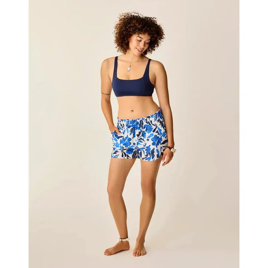A model wearing Carve Designs Women's Bali Short in Cloud Mezcal stands against a plain background.