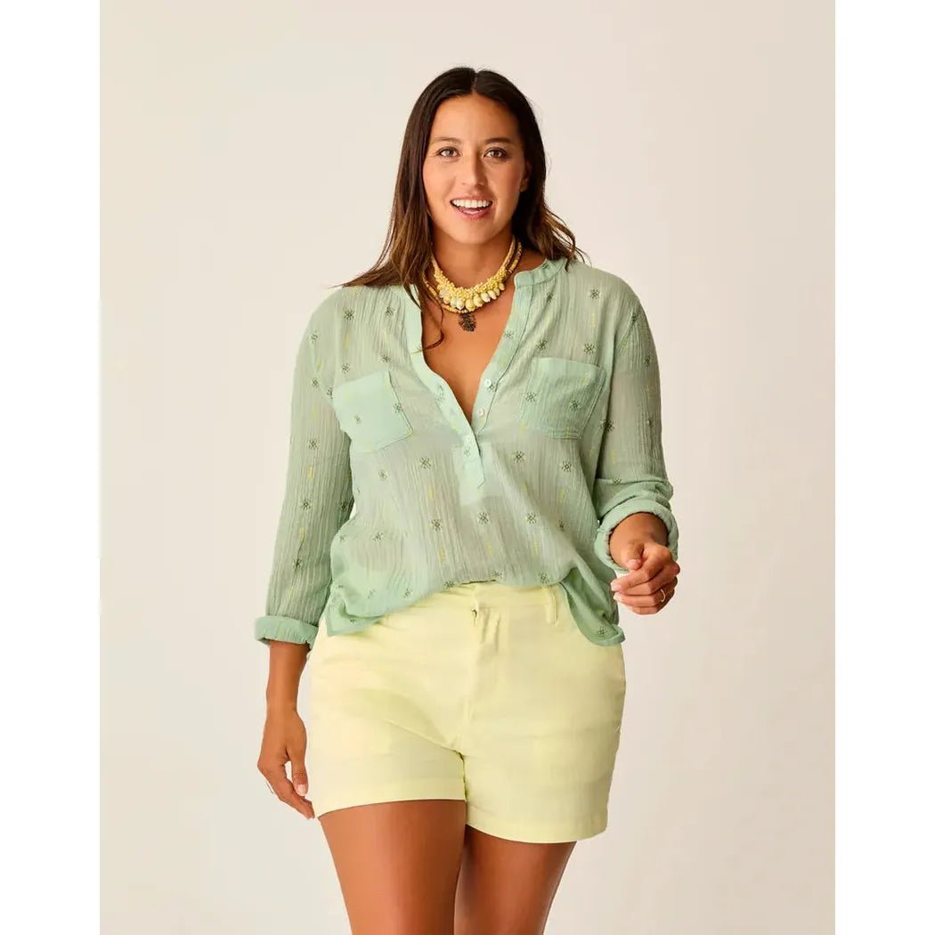 A woman wearing the Carve Designs Women's Dylan Gauze Shirt in Haze Print stands against a plain background.