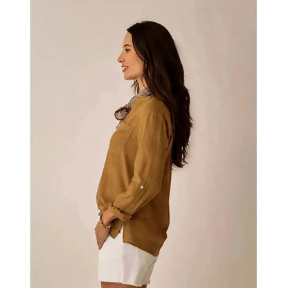 Side view of the Carve Designs Women's Dylan Textured Shirt in Golden showing the buttoned sleeve against a neutral background.