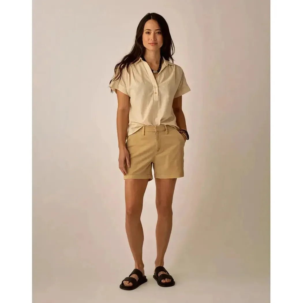 A model wearing the Carve Designs Women's Elliott Volle Top in Captain Pinstripe stands against a neutral background.