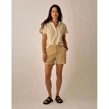 A model wearing the Carve Designs Women's Elliott Volle Top in Captain Pinstripe stands against a neutral background.