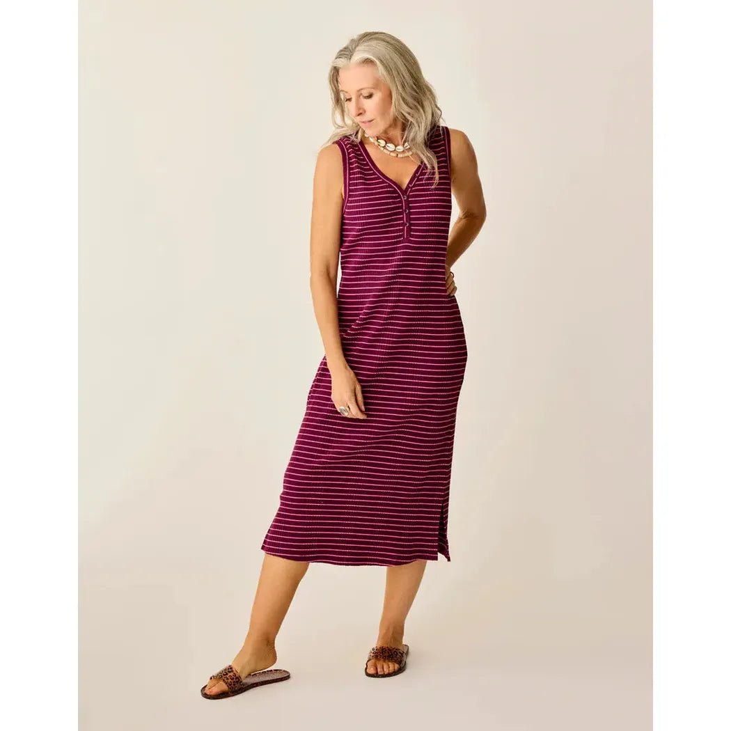 A woman wearing the Carve Designs Women's Elodie Rib Dress in Nirvana Stripe stands against a plain background.