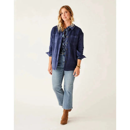 A model wearing the Carve Designs Women's Hudson Stretch Cord Shacket in Navy stands against a plain white background.