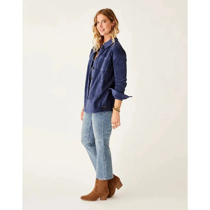 Side view of the Carve Designs Women's Hudson Stretch Cord Shacket in Navy showing the rolled cuffs and a model wearing it against a white background.