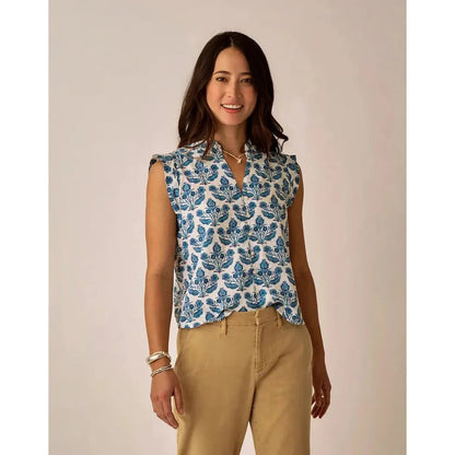A woman wearing the Carve Designs Women's Reagan Top in Cloud Texture stands against a neutral background.