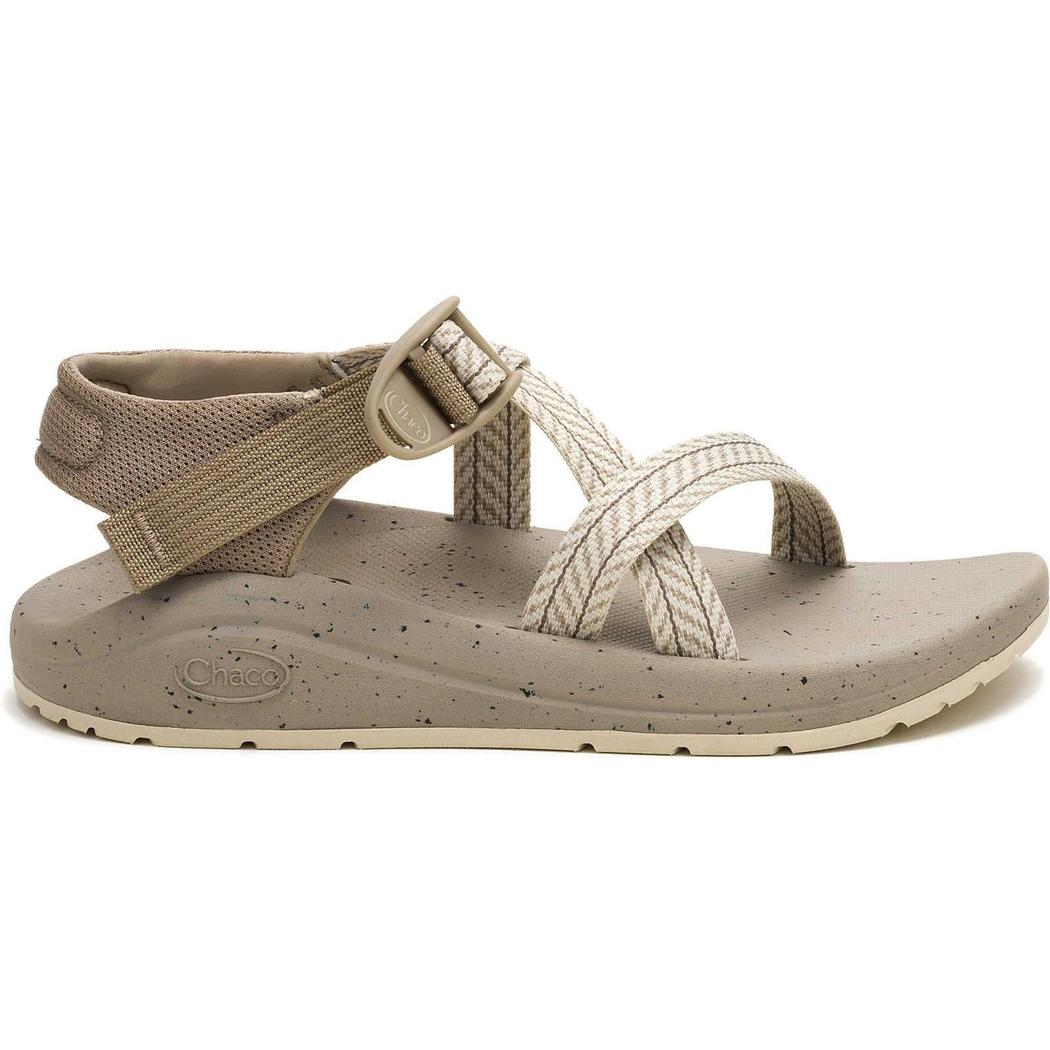 Side view of the Chaco Women's Chuhz sandals in Frond Dark Vanilla with crisscross straps and an ankle strap buckle against a white background.