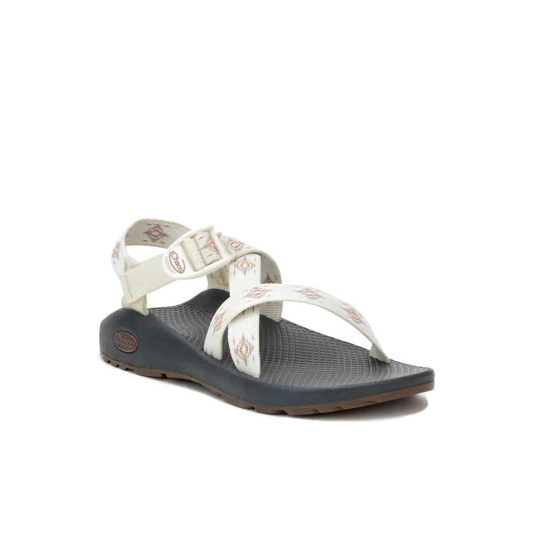A side view of the Chaco Women's Z1 Classic sandals in Oculi Sand with a white background.