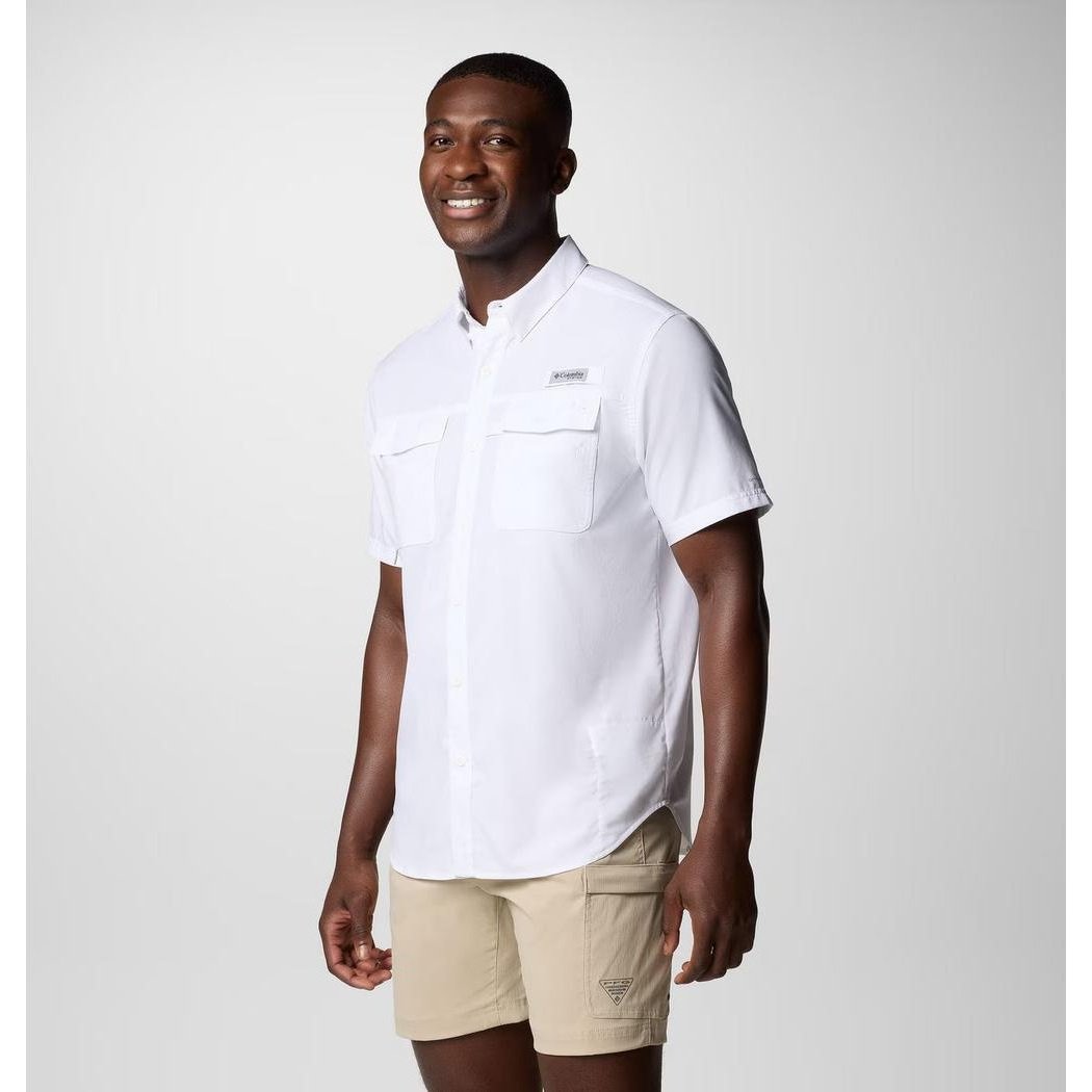 A man wearing the Columbia Sportswear Men's Blood and Guts V Short Sleeve Shirt in White stands against a plain background.