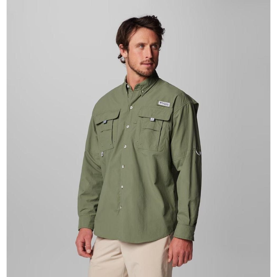 A front view of the Columbia Sportswear Men's PFG Bahama II Long Sleeve Shirt in Fossil, showing chest pockets and a model wearing it against a light gray background.