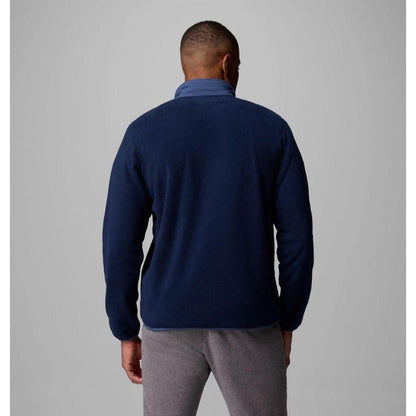 Back view of the Columbia Sportswear Men's Sequoia Grove Half Zip Fleece in Collegiate Navy/Dark Mountain on a model against a gray background.