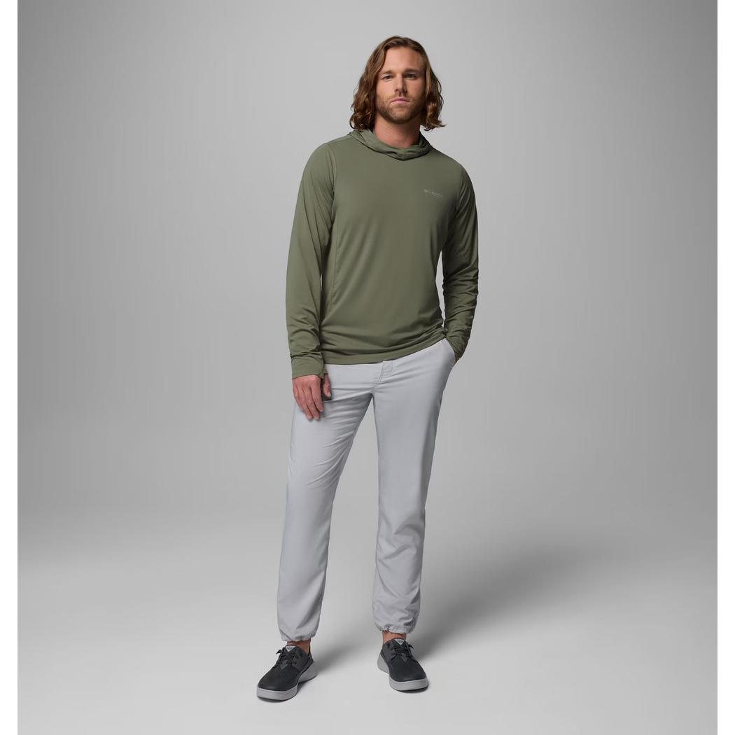 A model wearing the Columbia Sportswear Men's Shoaltech Hoodie in Cypress stands against a gray background.