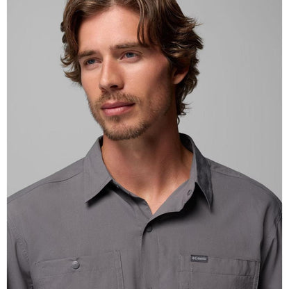 A front view of the Columbia Sportswear Men's Silver Ridge Utility II LS Shirt in City Grey with a model wearing it against a plain background.