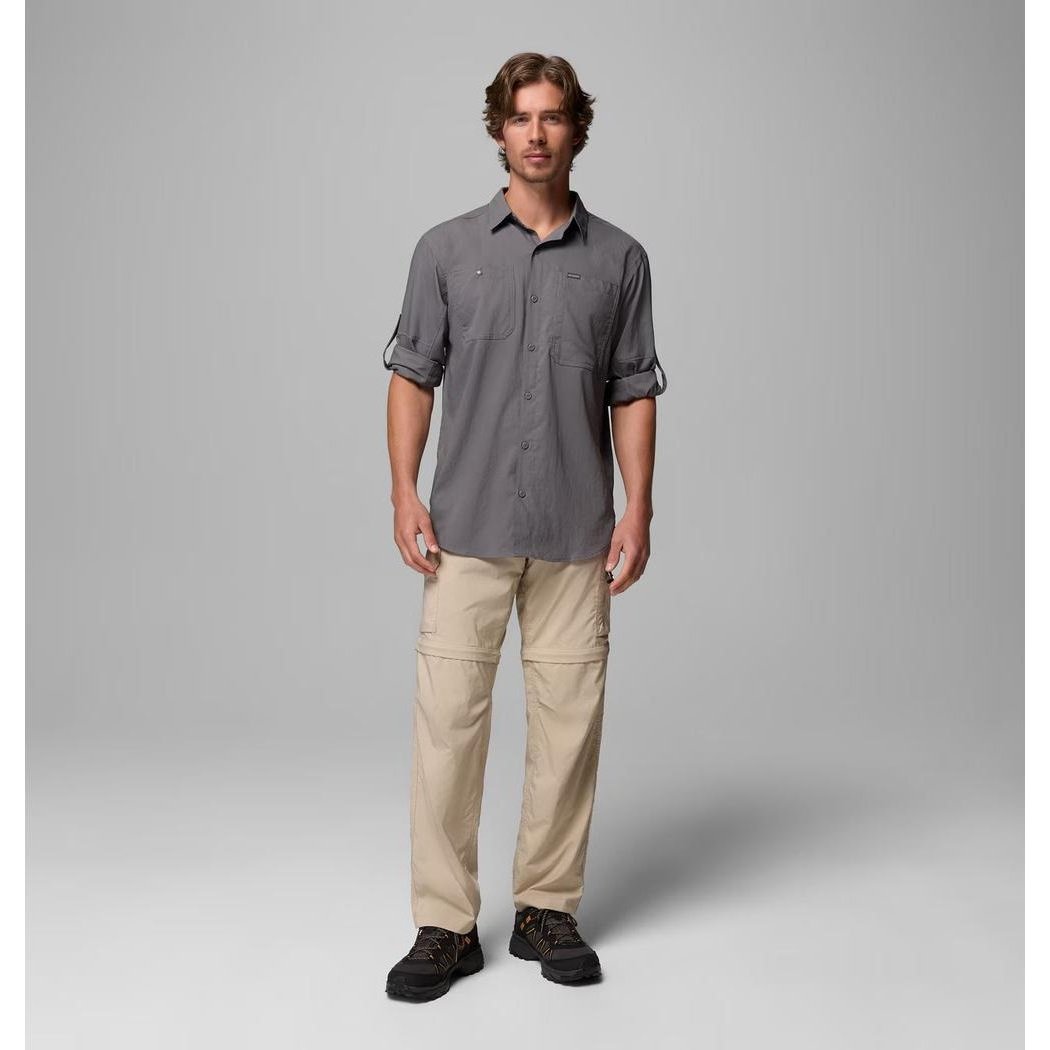 A model wearing the Columbia Sportswear Men's Silver Ridge Utility II LS Shirt in City Grey stands against a plain grey background.