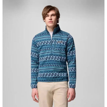 A model wears the Columbia Sportswear Men's Sweater Weather Printed Half Zip in Dark Stone Madras Tonal against a light gray background.