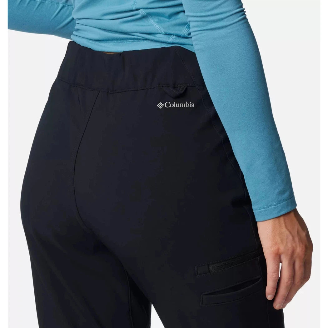 Back view of the Columbia Sportswear Women's Back Beauty High-Rise Pant in Black showing the cargo pocket and Columbia logo on the back against a white background.