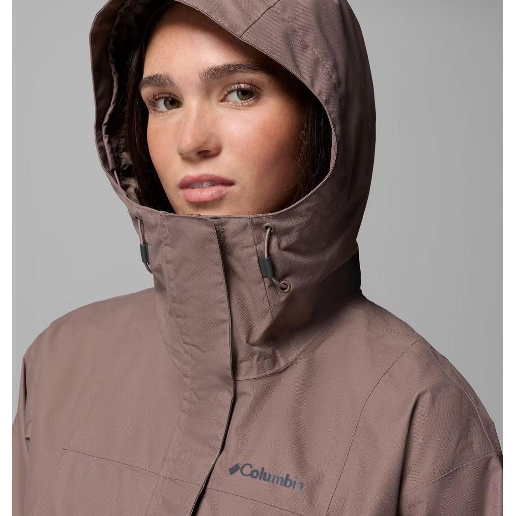 A front view of the Columbia Sportswear Women's Hikebound II Long Jacket in Iron, showing the hood and logo on a gray background.