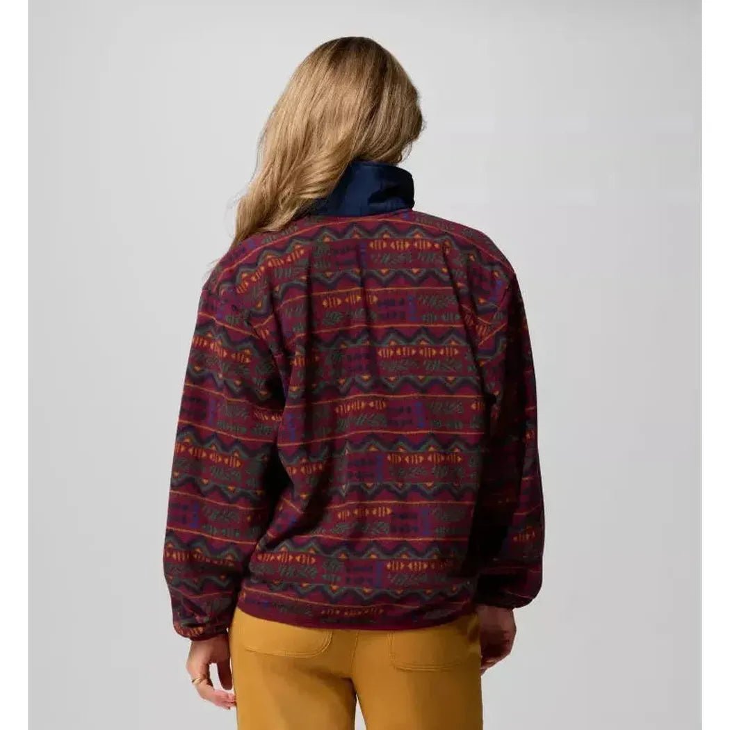 Back view of the Columbia Sportswear Women's Sequoia Grove Printed Half Zip in Rich Wine Horizons on a model wearing tan pants against a light gray background.