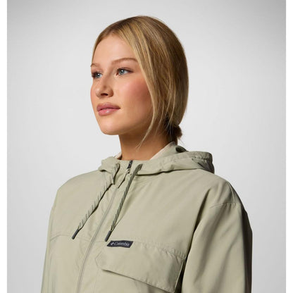 A side view of the Columbia Sportswear Women's Skien Valley Hooded Long Sleeve Shirt in Lavender Pearl, showing the front pocket and hood against a light gray background.