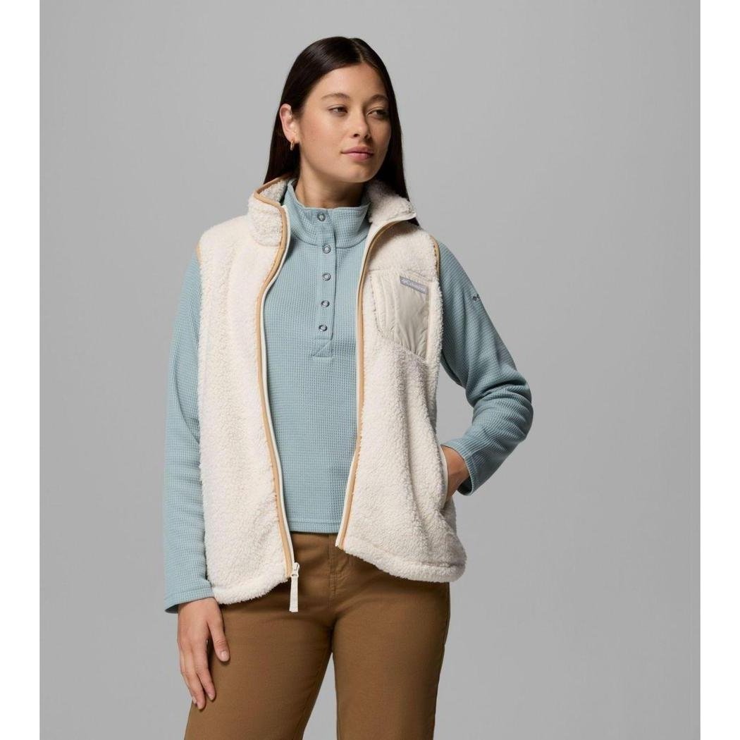 A model wearing the Columbia Sportswear Women's West Bend Fleece Vest II in Chalk stands against a gray background.