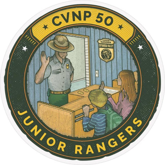 A circular sticker shows a park ranger with two kids at a desk, labeled "CVNP 50" and "Junior Rangers" at the top and bottom.