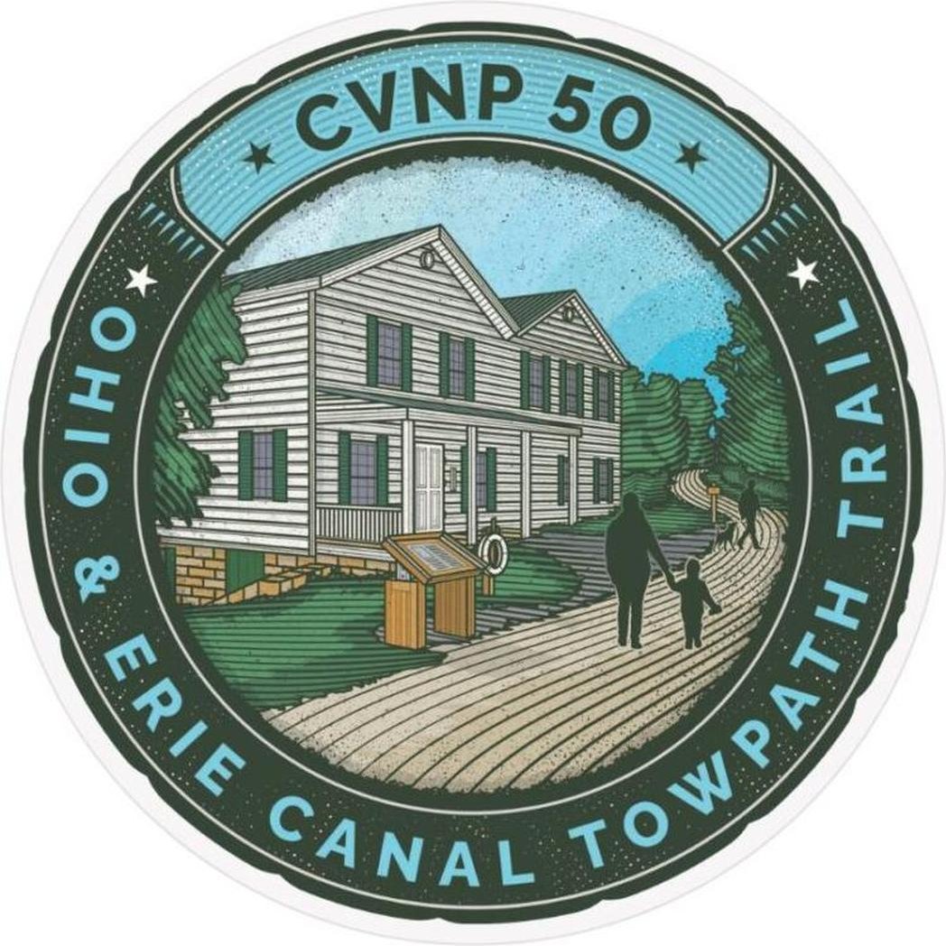 A circular sticker for the CVNP 50th Anniversary shows a white house, a parent and child on a towpath trail, and text around the edge.