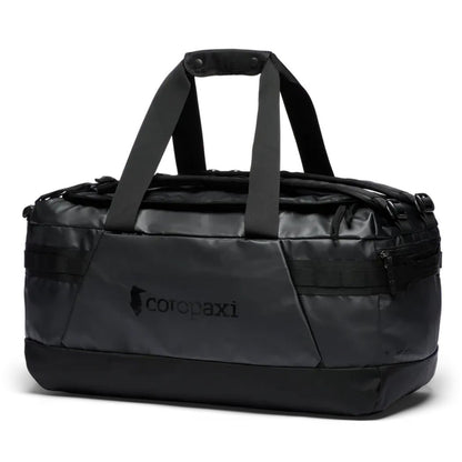 A front view of the Cotopaxi Allpa Getaway 55L Duffel in Cotopaxi Black with dual handles and a zippered pocket.