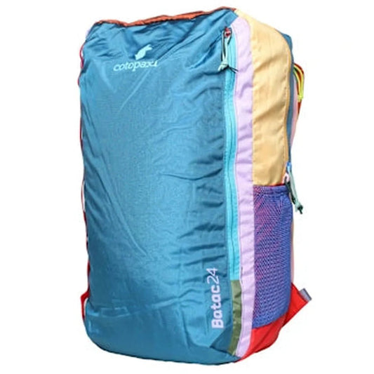 Side view of the Cotopaxi Batac 24L Pack in Del Dia II showing the front zip pocket and mesh side pocket against a white background.